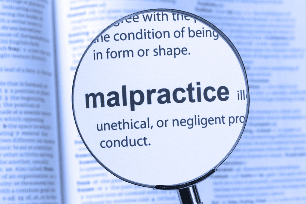 definition of malpractice magnified under magnifying glass