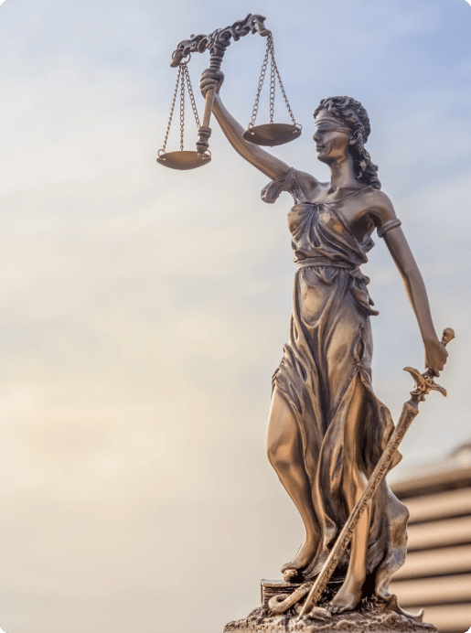 Lady of justice statue holding scales and a sword in her hand