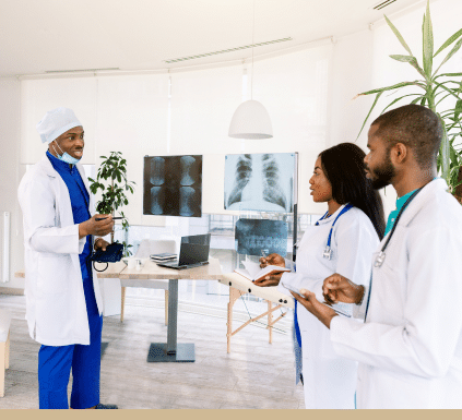 A doctor teaching and reviewing x-rays with resident students at HCA westside