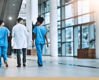 The image depicts a group of healthcare professionals, including doctors and nurses, walking together in a hospital setting.