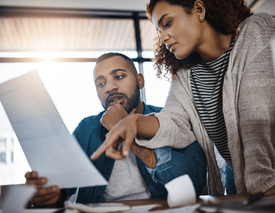 a man and a woman researching if the doctor has been sued