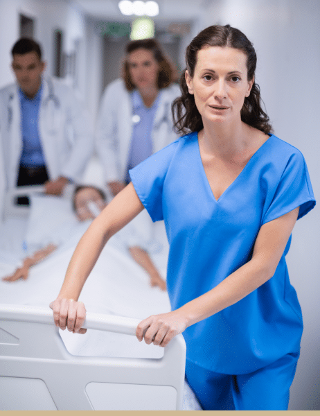 Doctors and nurse pushing a patient on bed.