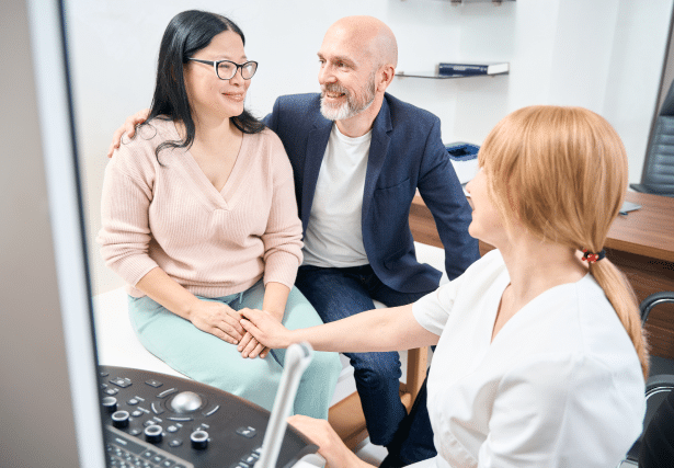 Cancer patient with her significant other and doctor supporting her through a tough conversation